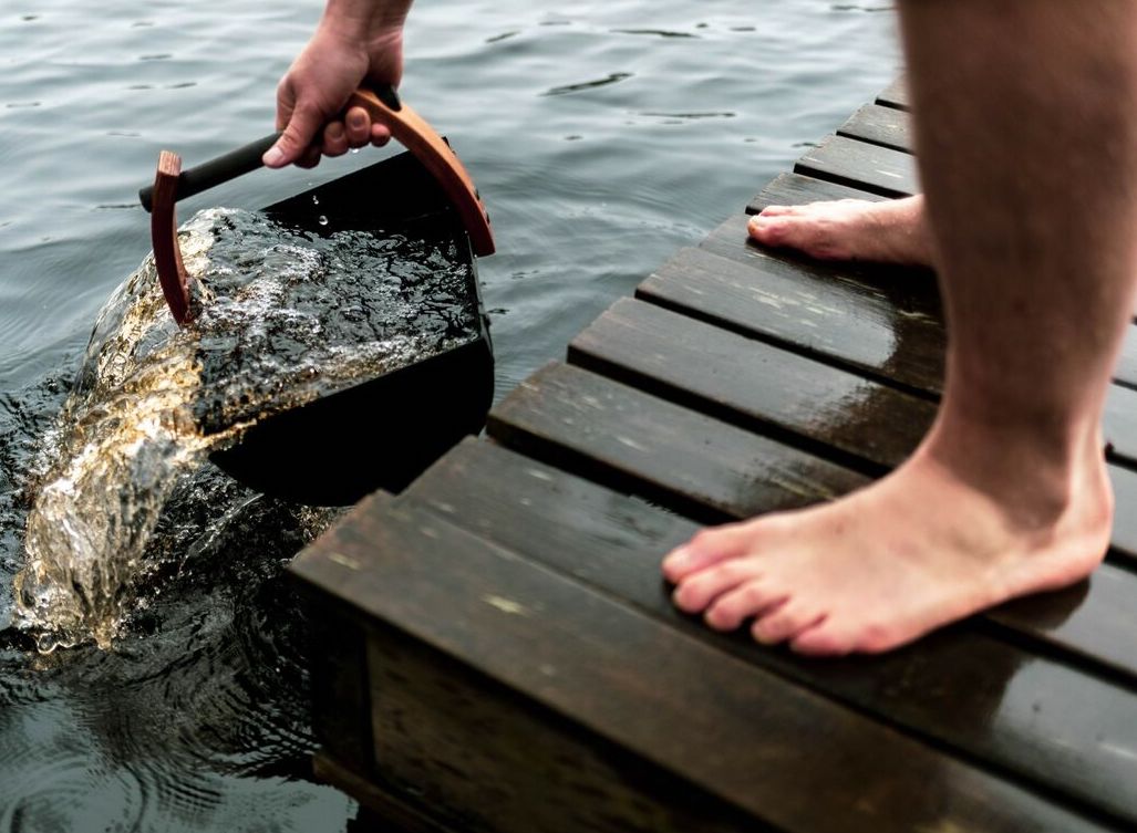 Legend bucket in use on a wooden deck.