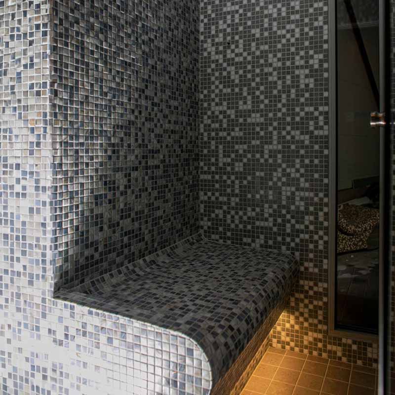 Mist outdoor Turkish bath on a tiled bench in the shower.