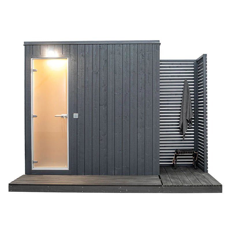 Mist outdoor Turkish bath with glass door and hanging towel.