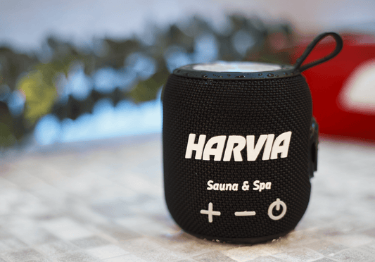 Black Harvia Sauna Bluetooth Speaker on a counter.