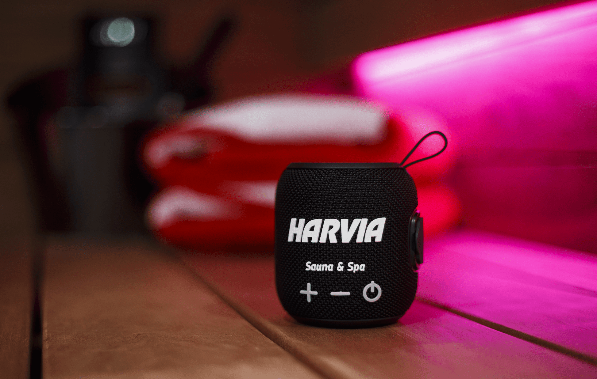 Harvia Bluetooth sauna speaker with wooden surface.