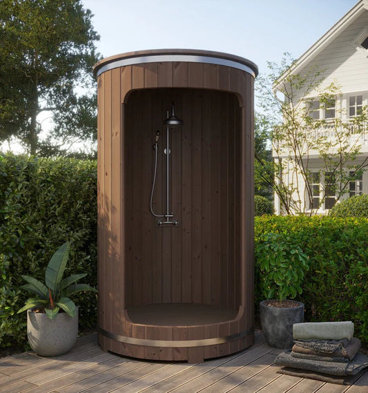 Outdoor wooden barrel shower with plants.