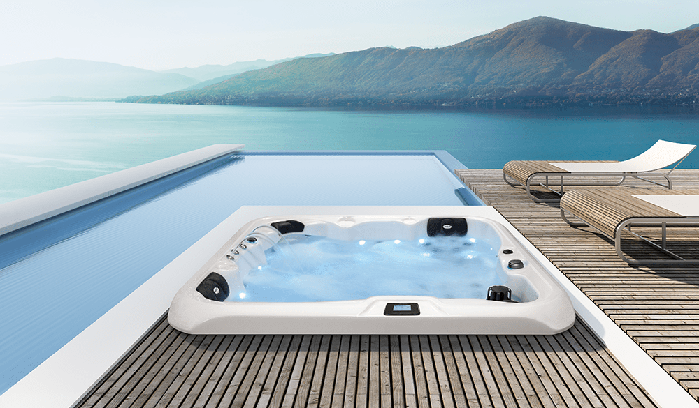 Double 520 outdoor Jacuzzi on deck overlooking the water.