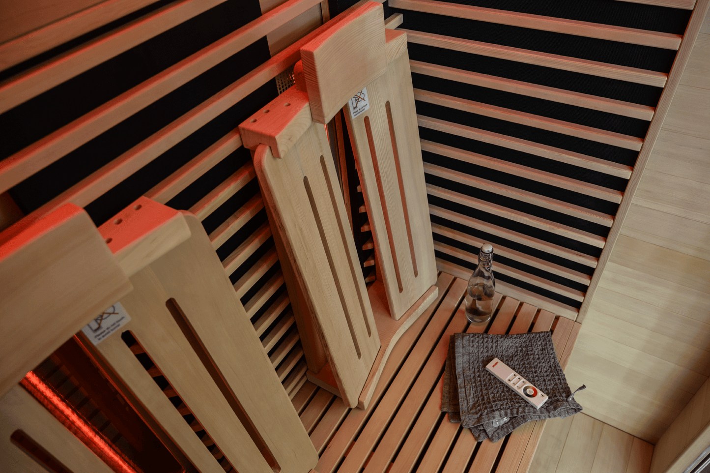 Spectrum infrared sauna with wooden hemlock chairs.