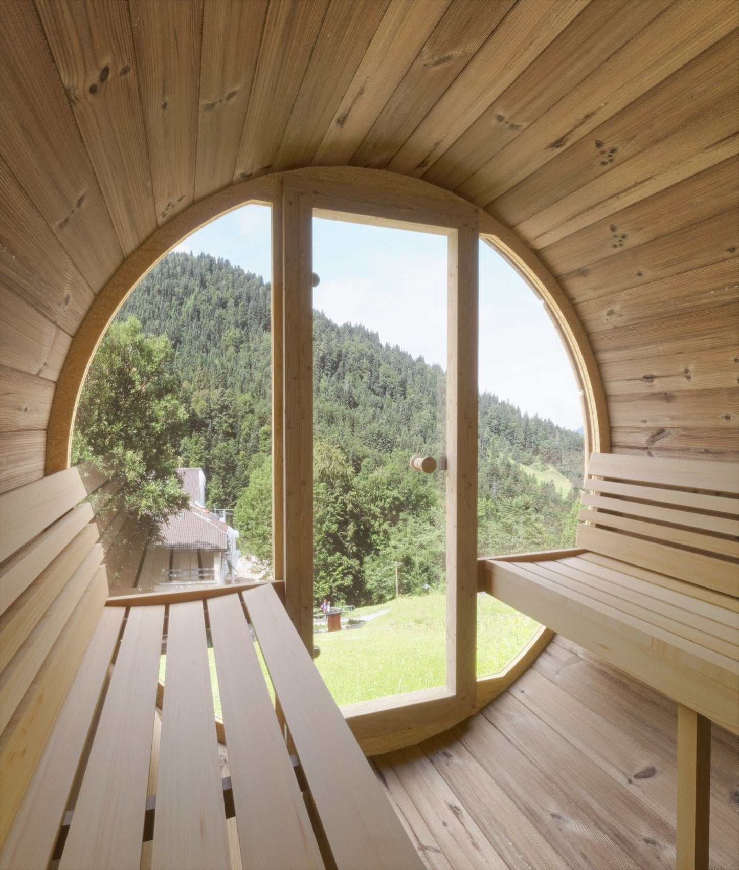 Ergo outdoor sauna in round room with window.