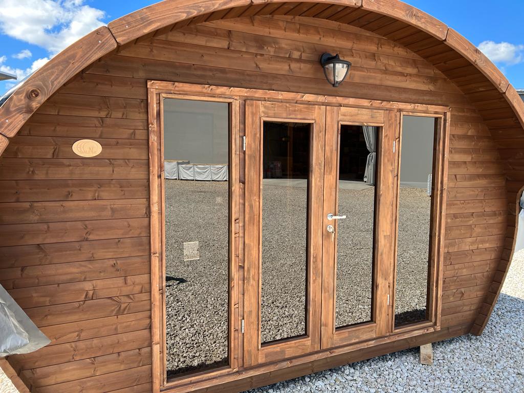 Hobbit 500 outdoor sauna with glass windows and doors.