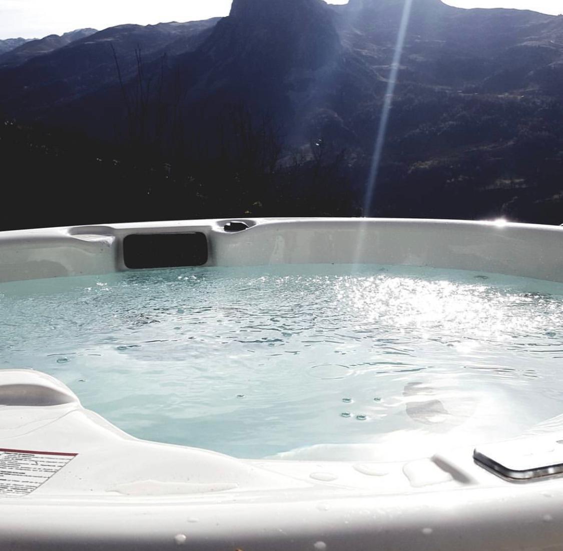 Serena 210 Jacuzzi with mountains in the background.