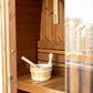 Outdoor sauna Cube 125 with bucket and wooden spoon.