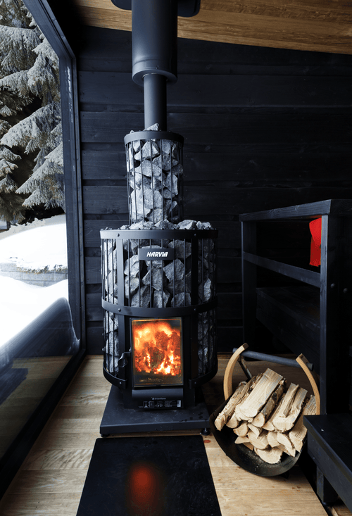 Wood heater - Harvia Legend 240 with fire burning.