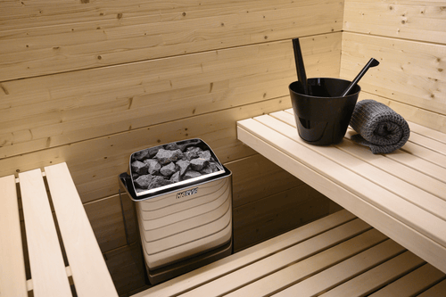 Harvia KIP electric sauna heater with buckets.
