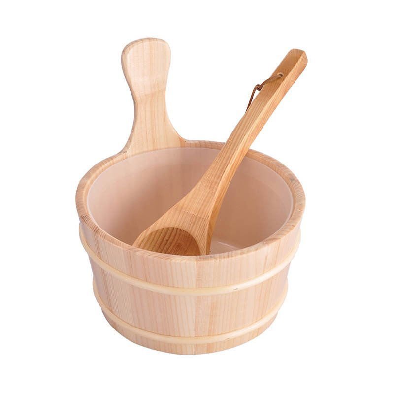 Sauna accessory set with bucket and wooden ladle.