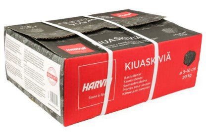 Pierres de saunas pour chauffages (Harvia) dans une boîte avec une étiquette blanche.