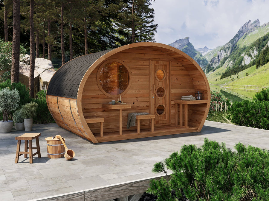 Hobbit 300 outdoor sauna with rustic design and outdoor table.