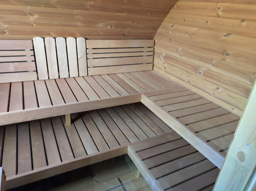 Hobbit 300 outdoor sauna with wooden bench.