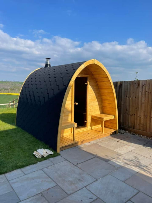 Outdoor Sauna Pod with wooden structure in the garden.