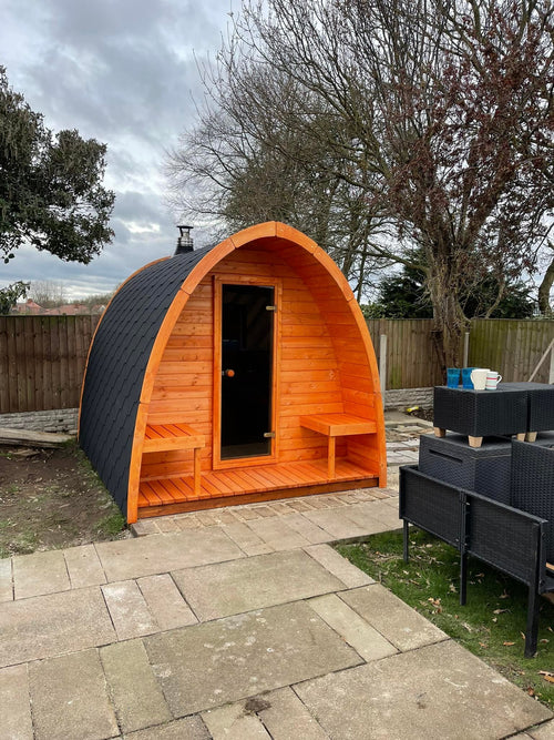 Outdoor sauna Pod in wooden structure in the backyard.