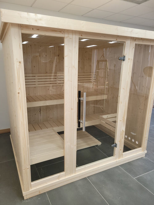 Large indoor sauna with glass doors and sturdy structure.