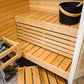 Sirius Corner sauna with wooden bench and black bucket.