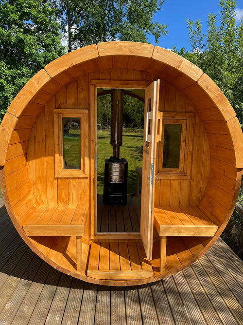 Barrel 250 outdoor sauna with glass door.