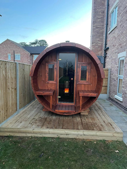Barrel 250 outdoor sauna with cylindrical wooden design.