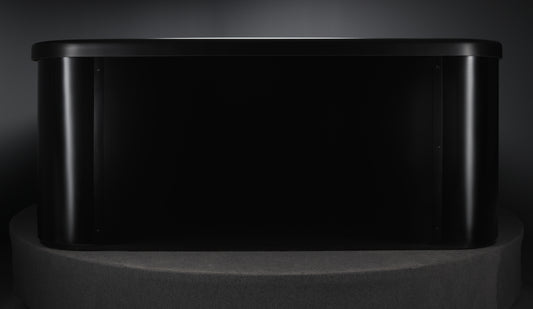 Vellamo Black outdoor spa on a minimalist pedestal.